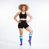 Knee high compression socks - gradient purple, blues, and pink on model
